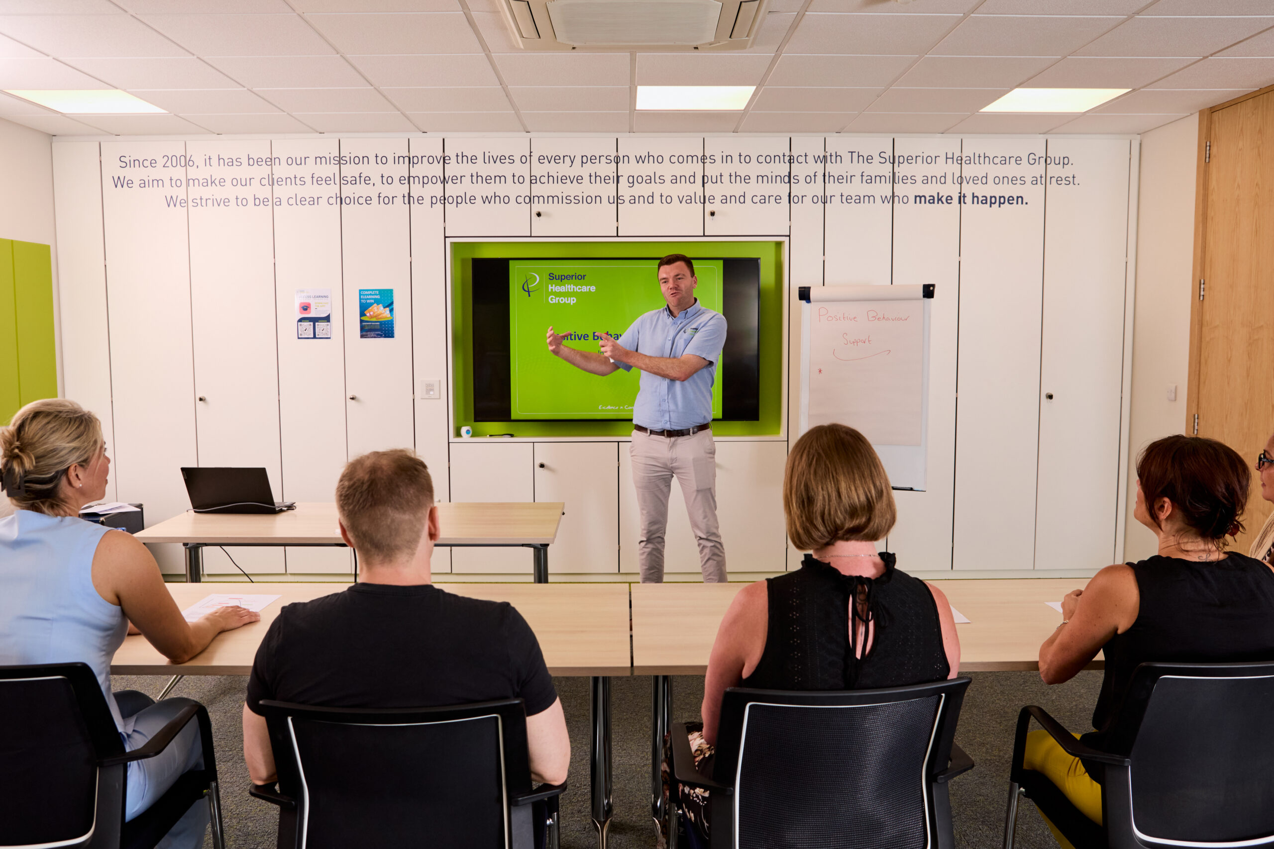 Image of one of our trainers teaching attendees of The Care Certificate training course.