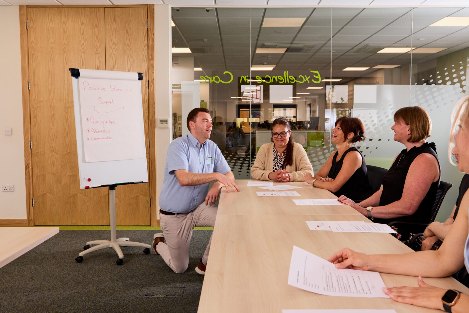 Image of one of our trainers on the Safeguarding Level 2 and Professional Boundaries training course engaging with a group of attendees.