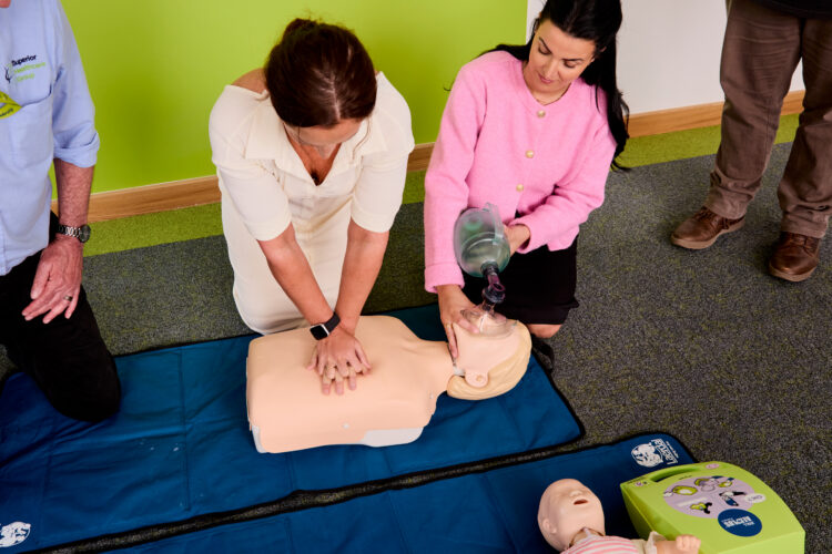 Image of attendees learning basic life support as part of The Care Certificate