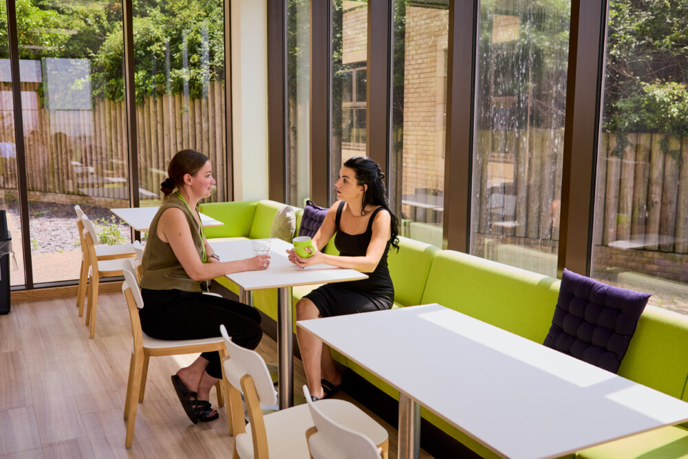 Image of two attendees discussing the Safeguarding Level 2 and Professional Boundaries training course